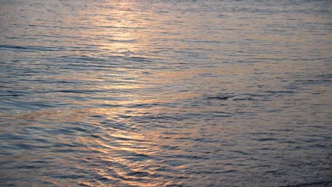 Mesmerizing interplay of light and water as the sun dips below the horizon Stock Footage 319433526
