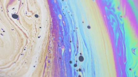 Mesmerizing iridescent soap bubble surface with flowing colors and dark spots Stock Footage 332167383