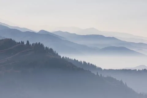 A mesmerizing landscape featuring several ridges of mountains, their silhouet Foto stock