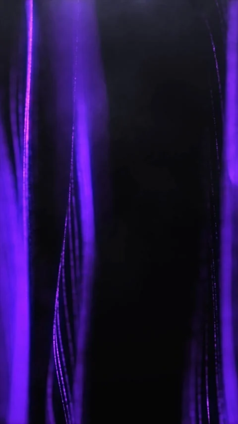 Mesmerizing light patterns shift and flow, displaying vivid purples Stock Footage 312694785