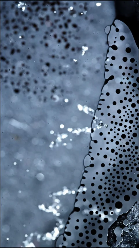Mesmerizing Macro View of Liquids Mixing with Bubbles in Vertical Alignment Stock Footage 328969217