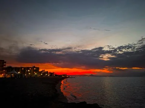Mesmerizing orange sunset over the Mediterranean Sea at Denia in Spain duri.. Stock Photos