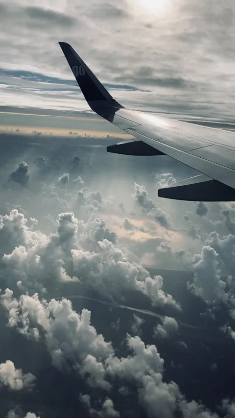 Mesmerizing Plane Takeoff Through Window - Rain Clouds and Land Below Stock Footage 287377181