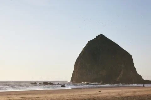 Mesmerizing scenery of sunset at Haystack Rock at the Pacific Ocean, Oregon Stock Photos