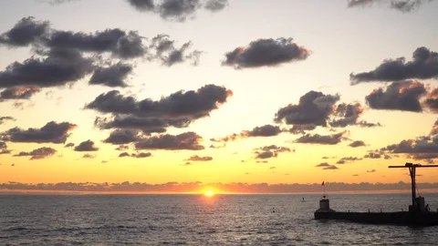 Mesmerizing sea sunset cloudy sky golden sun landscape ecology Stock Footage 116447006