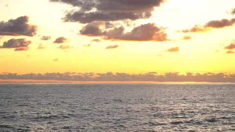 Mesmerizing sea sunset cloudy sky golden sun landscape ecology Stock Footage 116447061