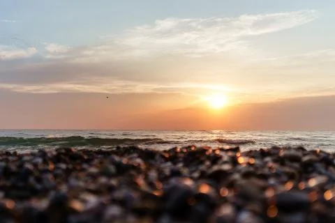 Mesmerizing Sea Sunset View With Pebble Beach.. Stock Photos