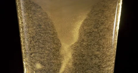 Mesmerizing Slow Motion Beer Bubbles and Foam Dancing in Glass Stock Footage 340078914