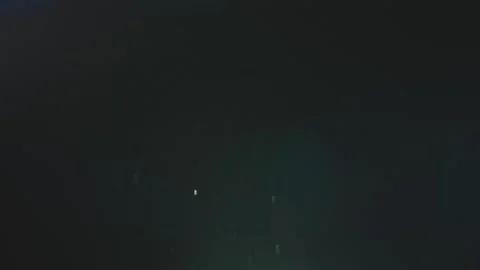 A mesmerizing slow motion display of dust particles floating through the ai.. Stock Footage 337523402