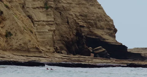 Mesmerizing Slow Motion Waves Crashing on Rocky Beach - High-Quality Stock Stock Footage 240958002