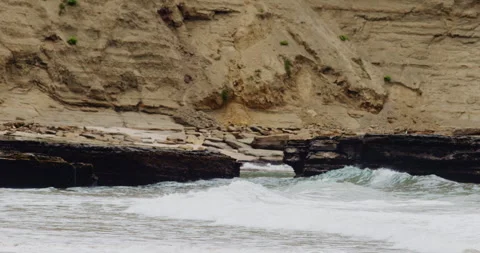 Mesmerizing Slow Motion Waves Crashing on Rocky Beach - High-Quality Stock Stock Footage 240963155