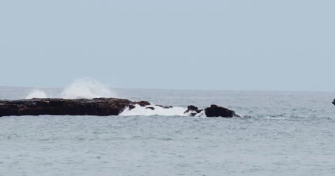 Mesmerizing Slow Motion Waves Crashing on Rocky Beach - High-Quality Stock Stock Footage 240963348