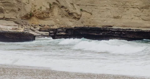 Mesmerizing Slow Motion Waves Crashing on Rocky Beach - High-Quality Stock Video stock 240964407