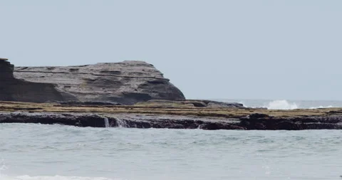 Mesmerizing Slow Motion Waves Crashing on Rocky Beach - High-Quality Stock Stock Footage 240965647
