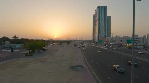 Mesmerizing Sunset on Dubai's Expressway: A Spectacular Drive through the Citysc Stock Footage 241551964