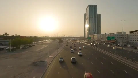 Mesmerizing Sunset on Dubai's Expressway: A Spectacular Drive through the Citysc Stock Footage 241552494