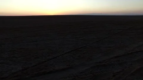 A mesmerizing sunset over the vast desert landscape casts, stock footage. Stock Footage 304818182