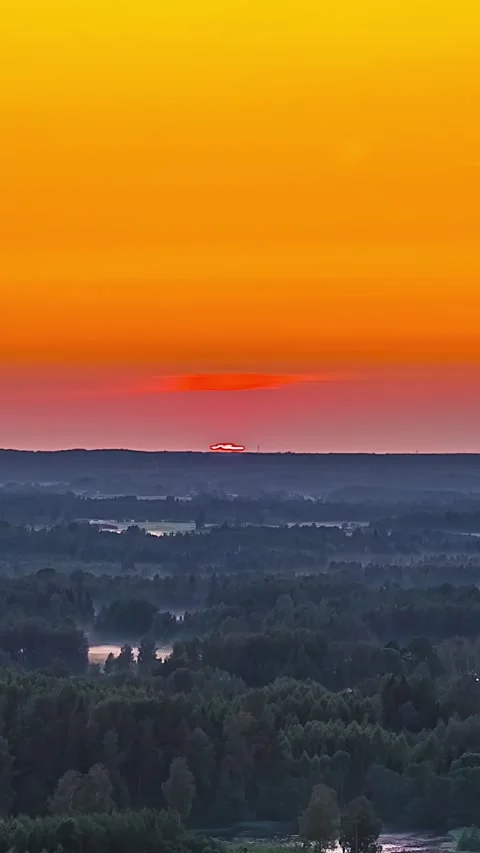 Mesmerizing Sunset Timelapse Over Forest Landscape in Vertical Format Stock Footage 333125835