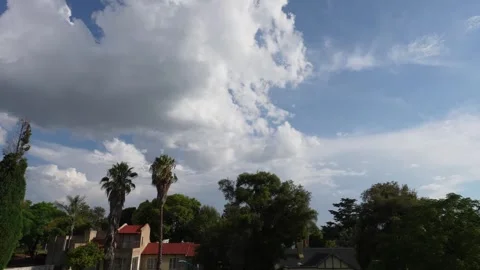 A Mesmerizing timelapse of clouds moving across the horizon over peoples homes Stock Footage 263770724