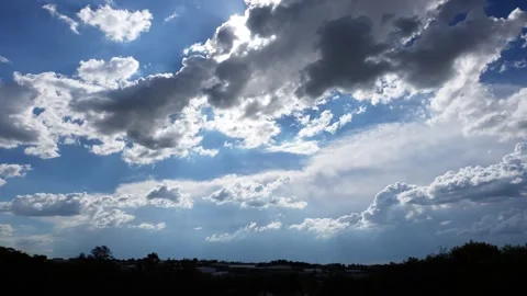 A Mesmerizing timelapse of clouds moving across the horizon over peoples homes Stock Footage 263770728