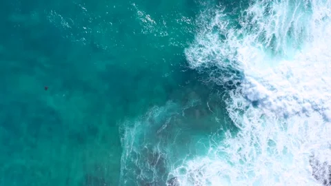 Mesmerizing top-down aerial footage powerful turquoise ocean waves crashing Stock Footage 334138518