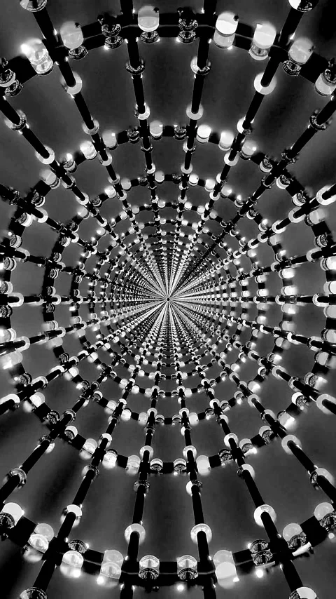 Mesmerizing tunnel video loop creates an endless spiral of lights in black .. Video stock 321264714
