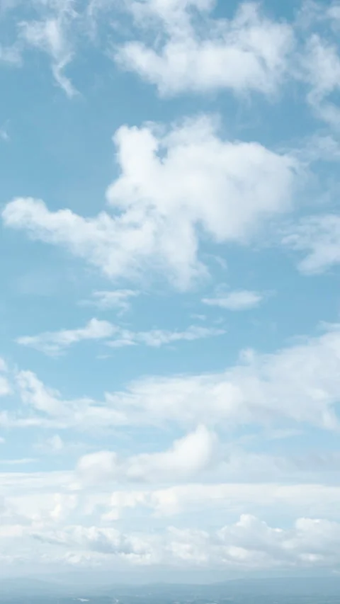 A mesmerizing vertical drone timelapse capturing the beauty of white cloud Stock Footage 304251598