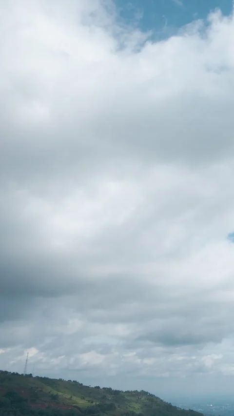 A mesmerizing vertical drone timelapse showcasing dynamic clouds Stock Footage 304251388