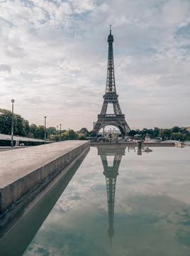 A mesmerizing view of the iconic Eiffel Tower in the early morning in Paris,  Stock Photos