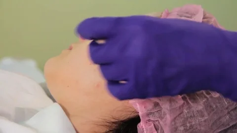 Meso glow bb procedure. The hands of the beautician apply the medication on the Video stock 83620373