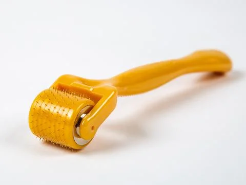 Mesoroller for the face on a white background. A tool for skin rejuvenation. Stock Photos