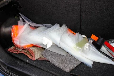 A mess of Different things in the trunk of a car. Stock Photos