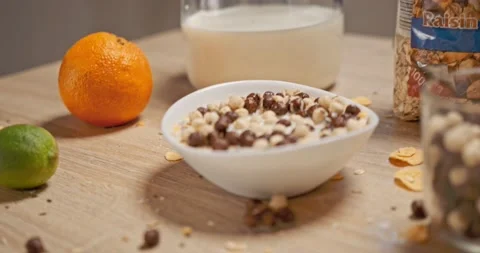 Mess in the kitchen at breakfast - cereals , cornflakes Stock Footage 146178067