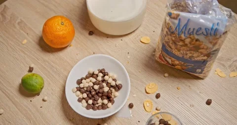 Mess in the kitchen at breakfast - cereals , cornflakes Stock Footage 146178252