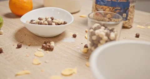 Mess in the kitchen at breakfast - cereals , cornflakes Stock Footage 146178371