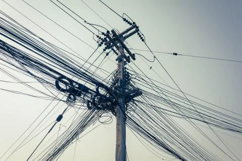 Mess of Wire and cable clutter on electric pole Stock-Fotos