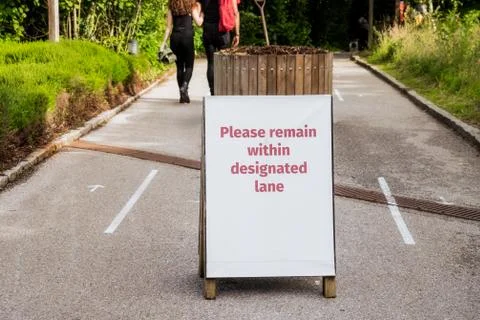 Message about keeping a safe distance and using different directions route lines Stock Photos
