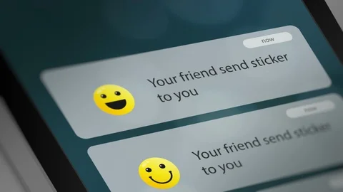 Message App with Sticker/Emoticon Notification on Smart Phone Device Stock Footage 118844276