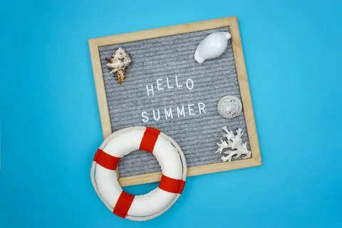 A message on a board that says hello summer Stock Photos