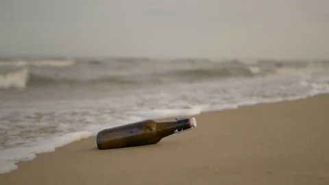 Message in a bottle on the beach Stock Footage 97874089
