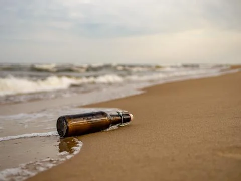 Message in a bottle on the beach Stock Photos