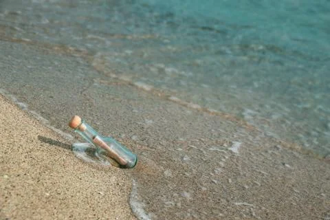 Message in a bottle on the beach seaside Stock Photos