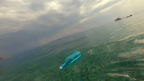 Message in a bottle floating in the sea. Stock Footage 143950809
