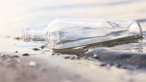 Message in a bottle found on a tranquil beach at sunset Stock-Footage 295283912