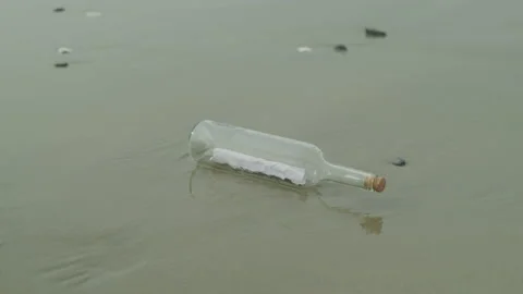 Message in a Bottle on the Sand Stock Footage 208754748