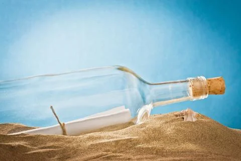 Message in bottle on sand Stock Photos
