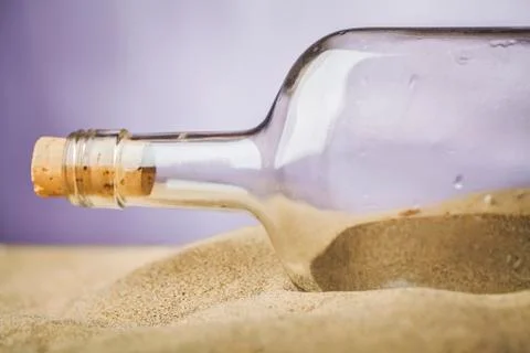 Message in bottle on sand Stock Photos