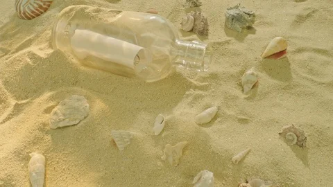 Message in a bottle on a sandy beach, macro Video stock 111858877