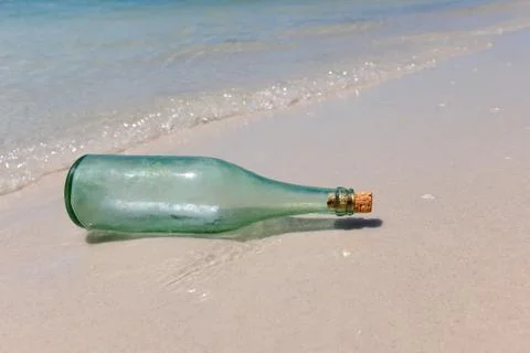 Message in a Bottle on Shore Stock Photos
