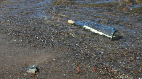 Message in a bottle in the water at the beach on the Baltic coast Stock Footage 11134601